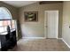 Bright living room with tiled floors, natural light, and neutral wall paint at 231 Cranbrook Dr, Kissimmee, FL 34758