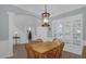 Elegant dining room showcasing a chandelier, neutral walls, and wood-look flooring at 2362 Blossomwood Dr, Oviedo, FL 32765