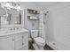 Charming bathroom featuring white subway tiles, updated fixtures, and a modern vanity at 2405 Janet St, Kissimmee, FL 34741