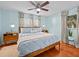 Relaxing bedroom with a ceiling fan, stylish light fixtures, and hardwood floors at 2405 Janet St, Kissimmee, FL 34741