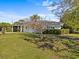 Charming single-story home with a well-maintained lawn and mature landscaping at 2405 Janet St, Kissimmee, FL 34741