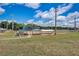 Community baseball field with covered seating, offering sports and recreational activities at 2604 Hollow Ln, Leesburg, FL 34748