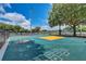 Community basketball court with colorful hopscotch, providing recreational opportunities for residents at 2604 Hollow Ln, Leesburg, FL 34748