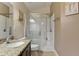 Bathroom featuring a glass enclosed shower and granite countertops at 2604 Hollow Ln, Leesburg, FL 34748