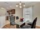 View of dining area with glass table and modern lighting at 2604 Hollow Ln, Leesburg, FL 34748