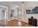 Inviting entryway with wood floors, a console table, and a view of the front door at 2604 Hollow Ln, Leesburg, FL 34748