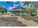 Community gazebo with ample seating and a beautiful view, perfect for gatherings and relaxation at 2604 Hollow Ln, Leesburg, FL 34748