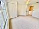 Bedroom showcasing a closet, a ceiling fan, and a window at 2605 Gala S Rd # 103, Kissimmee, FL 34746