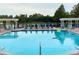 Beautiful swimming pool surrounded by lounge chairs and beautiful foliage, perfect for a relaxing day outdoors at 2605 Gala S Rd # 103, Kissimmee, FL 34746