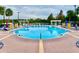 Enjoy a refreshing swim in the pristine community pool with ample lounge seating and scenic lake views at 2605 Gala S Rd # 103, Kissimmee, FL 34746