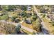 An aerial shot displaying the property's location, surrounding streets, and lush landscaping in the neighborhood at 33 Sunset Dr, Debary, FL 32713