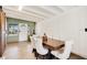 Elegant dining room with a modern table, stylish chairs, and luxury vinyl plank flooring at 33 Sunset Dr, Debary, FL 32713