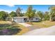 Well-maintained home with a clean exterior, a paved driveway, and an attached garage at 33 Sunset Dr, Debary, FL 32713