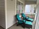 Cozy front porch seating area featuring comfortable chairs and footrests with a view at 3315 Newbliss Cir, Ormond Beach, FL 32174