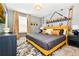 A playful bedroom with a 'Minions' theme, featuring a gray color scheme accented with bright yellow pops at 3373 Lilac Way, Davenport, FL 33897