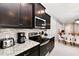 Kitchen featuring granite countertops, stainless appliances, and mosaic backsplash at 3373 Lilac Way, Davenport, FL 33897