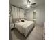 Spacious bedroom with a comfortable bed, mirrored closet, and minimalist decor at 36104 Emeralda Ave, Leesburg, FL 34788