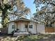 Charming single-story home with a cozy front porch and inviting swing at 36104 Emeralda Ave, Leesburg, FL 34788