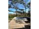 Backyard pool surrounded by a wooden deck and natural landscape views at 36104 Emeralda Ave, Leesburg, FL 34788