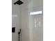 Shower stall featuring black fixtures and a shower window at 36104 Emeralda Ave, Leesburg, FL 34788