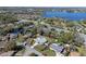 Aerial view of a home near a lake highlighting the home's setting within its neighborhood and outlined property at 382 Frances Ave, Casselberry, FL 32707