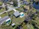 Aerial view of a home with a pool, showcasing its layout and proximity to a pond at 382 Frances Ave, Casselberry, FL 32707