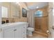 Well lit bathroom with a tile shower and upgraded white vanity at 382 Frances Ave, Casselberry, FL 32707