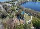 Aerial view of the community park with tennis courts, playgrounds, green spaces, and lake access at 382 Frances Ave, Casselberry, FL 32707