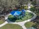 Community playground featuring slides and shaded play area surrounded by sidewalks and mature trees at 382 Frances Ave, Casselberry, FL 32707