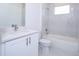 Bathroom with marble tiled shower, tub, toilet, and white quartz vanity at 41915 Aspen St, Eustis, FL 32736