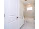 Modern bathroom with marble tile, white vanity, tub, shower, and neutral walls at 41915 Aspen St, Eustis, FL 32736