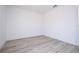 An empty room featuring light wood-look floors and bright, white walls at 41915 Aspen St, Eustis, FL 32736