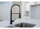 Close-up of the kitchen sink with a stainless steel basin and modern black faucet at 41915 Aspen St, Eustis, FL 32736