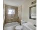 Well-lit bathroom with tiled shower and updated sink at 4270 Solomon Dr, Orlando, FL 32811