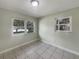 Bright bedroom with tiled floors and windows letting in natural light at 4270 Solomon Dr, Orlando, FL 32811