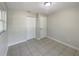 Bedroom featuring tiled floors, closet space, and a window at 4270 Solomon Dr, Orlando, FL 32811