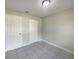 A bedroom with neutral paint and tiled flooring at 4270 Solomon Dr, Orlando, FL 32811