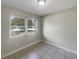 Bedroom with tiled floor and window at 4270 Solomon Dr, Orlando, FL 32811