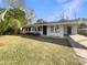 Charming single-story home with a well-manicured lawn and attached carport at 4270 Solomon Dr, Orlando, FL 32811