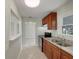 Well-lit kitchen with stainless steel appliances, double sink, and granite countertops at 4270 Solomon Dr, Orlando, FL 32811