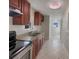 Well-lit kitchen with stainless steel appliances, double sink, and granite countertops at 4270 Solomon Dr, Orlando, FL 32811