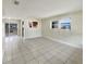 Spacious living room featuring tiled floors, natural light, and an open layout to the kitchen at 4270 Solomon Dr, Orlando, FL 32811