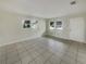 Bright living room with tile flooring and large windows at 4270 Solomon Dr, Orlando, FL 32811