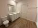 Bright bathroom featuring a quartz countertop, vanity, and tiled floor at 4972 Lyric Dr, Mascotte, FL 34753