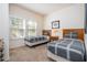 Charming bedroom featuring twin beds with gray patterned bedding and a window view at 5356 Diplomat Ct # 105, Kissimmee, FL 34746