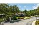 Aerial view of the Lucaya Village Clubhouse with manicured landscaping and parking at 5356 Diplomat Ct # 105, Kissimmee, FL 34746