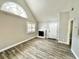 Living room with gray walls, wood-look flooring, white trim, a fireplace and natural light at 615 Richland Ct # 66, Altamonte Springs, FL 32714