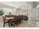 Dining room with large table, modern chandelier, and elegant archway at 620 Orange Cosmos Blvd, Davenport, FL 33837