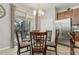 Kitchen dining area leads to the screened patio with sliding glass doors to let in natural light at 620 Orange Cosmos Blvd, Davenport, FL 33837