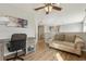 Upstairs bonus room features wood-look floors and a desk area, perfect for a home office at 620 Orange Cosmos Blvd, Davenport, FL 33837